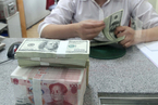 In Depth: Behind the Yuan’s Tumble Against the Dollar