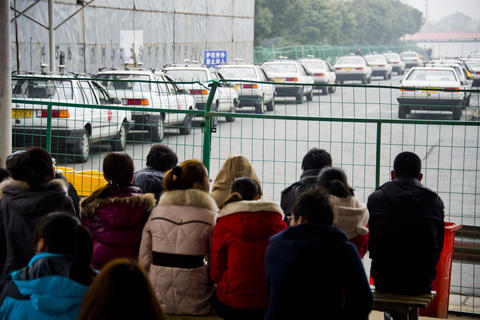 Aspiring drivers wait to take the test to get their driving licenses in Zhenjiang, Jiangsu Province