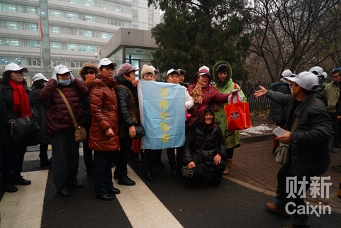 Parents from around China who have lost their children gather in front of the family planning commission on December 1