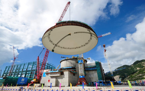 A containment structure dome is hoisted into place for one of  two reactors at the Taishan Nuclear Power Plant in Guangdong province during its construction phase in 2012. Photo: IC