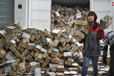 Workers sort out parcels at a delivery company in Hangzhou, Zhejiang province on Friday. The company saw three times more orders than on the same day last year. Photo: IC