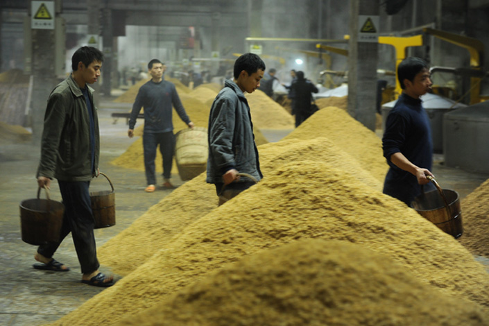 Employees work in a brewing factory of Wuliangye Group Co. Ltd in Yibin, Sichuan province, on Dec. 17, 2011. Photo: Visual China