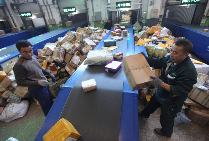 China Post workers dispatch Singles Day packages in Changchun, Jilin province, in mid-November. Chinese delivery companies were delivering about 125 million packages a day leading up to Singles Day, which is Nov. 11. Photo: China Visual