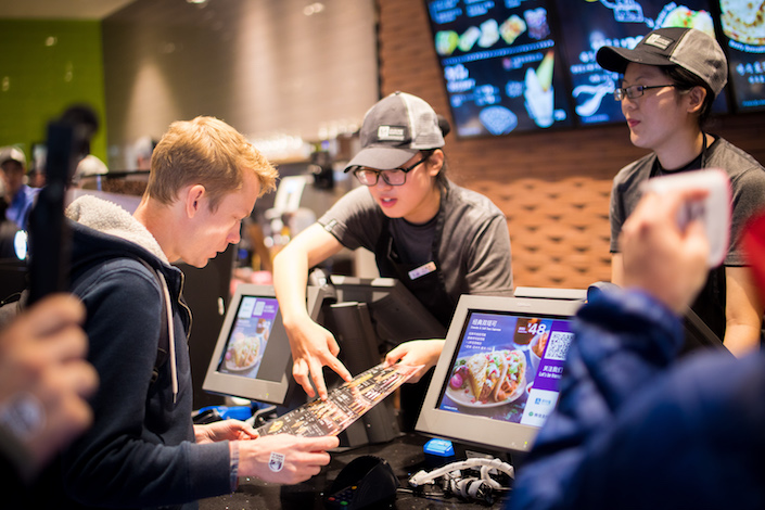 A customer orders at a newly opened Taco Bell in Shanghai. Photo: Taco Bell