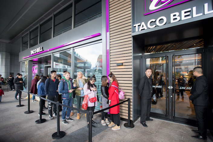 Customer wait in line to enter a newly opened Taco Bell restaurant in Shanghai. Photo: Taco Bell