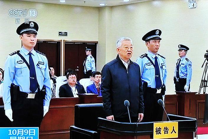 A CCTV screen grab shows Bai Enpei, the former Communist Party head of Yunnan province, standing trial at a court in Anyang, in central China's Henan province on Oct. 9 on corruption charges. Bai was convicted of accepting 246 million yuan ($35.5 million) in bribes and sentenced to death with a two-year reprieve. Photo: IC