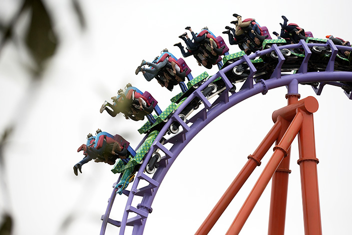 People ride a roller coaster at the Nanchang Wanda Park theme park in Nanchang, Jiangxi province, on May 28, 2016. Wanda Group has forecast a 4% operating profit growth in 2017. Photo:IC