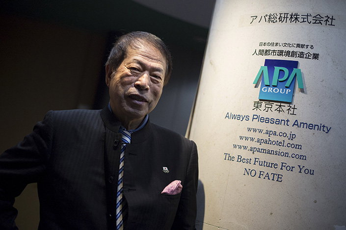 Motoya Toshio, the CEO of APA Group, poses for pictures at the hotel group's headquarters in Tokyo in April 2015. APA sparked outrage in China after placing in its hotel rooms Toshio's book. which claims the 1937 Nanjing Massacre never took place. Photo: Visual China