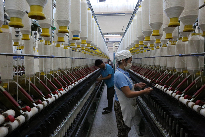 Workers work on the production floor of a state-owned textile enterprise in Huai'an, Jiangsu province, in October 2015. The Caixin China General Manufacturing Purchasing Managers’ Index rose to 51.7 last month from 51.0 in January. Photo: IC