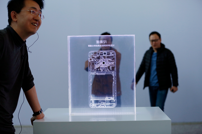 Smartphone maker Xiaomi Inc. has created its own central chipset to power some of its models, including the new 5C. The Pengpai S1 chip was unveiled Tuesday at the China National Convention Center. Photo: Visual China