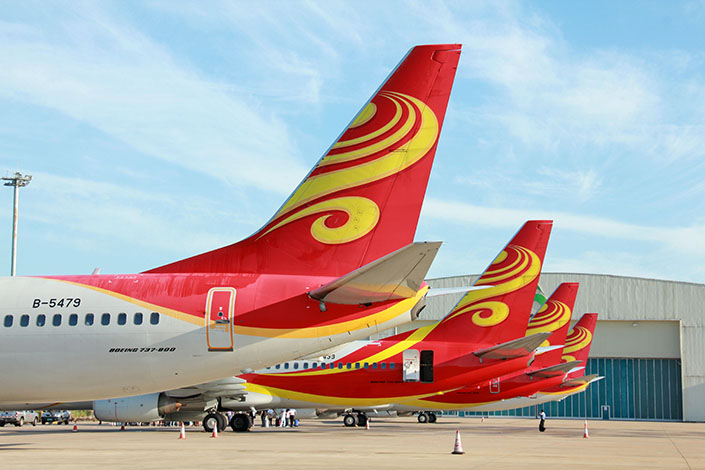 Jetliners of HNA Group's Hainan Airlines are seen at the Haikou Meilan International Airport in Haikou, Hainan province, on Sep.19, 2015. HNA Group has agreed to buy Singaporean logistics company CWT Ltd. for S$1.4 billion ($994 million). Photo:IC