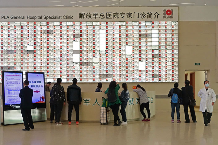 Patients queue in the outpatient department of the People's Liberation Army General Hospital in Beijing, on April 8, 2017. Beijing has been picked for the opening round of a sweeping reform project designed to address contentious issues affecting thousands of public hospitals in China. Photo: Visual China