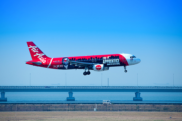 Malaysian budget airline AirAsia Berhad will form a joint venture in Henan province with China Everbright Group and the Henan government. Photo: Visual China