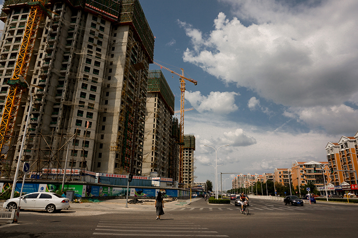 Housing construction is visible in the Tongzhou district of southeast Beijing in August 2015. The district said Tuesday it will form a joint working group with two nearby cities — the Wuqing area in Tianjin and Langfang in Hebei province — to crack down on property speculation across the three areas and on real-estate agencies that have been involved in irregular promotional activities. Photo: Visual China