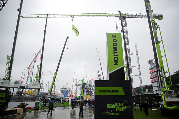 Zoomlion exhibits at the Bauma China 2016 fair in Shanghai. The construction equipment maker will sell its environmental business to an investor group for 11.6 billion yuan. Photo: Visual China