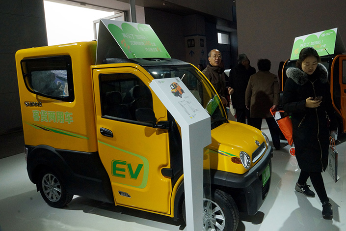 The Legislative Affairs Office of the State Council is mandating new-energy vehicle quotas of 8%, 10% and 12% for car producers  for the years 2018, 2019 and 2020 respectively. Above, a newsenergy vehicle is displayed at an E-bike expo in Tianjin on March 25. Photo: Visual China