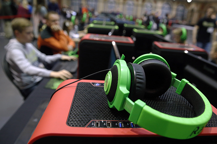 San Francisco-based Razer Inc., a maker of gaming accessories and software, has applied for an initial public offering in Hong Kong. Above, Razer headphones sit on a gaming unit at the 