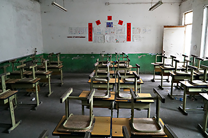 In Beijing's Changping district, many schools that are open to migrant children are being forced to move as the municipality slates the illegal structures for demolition. Some school officials still do not know where their schools will move to, or even if they will be open at all. Photo: Huang Ziyi/Caixin