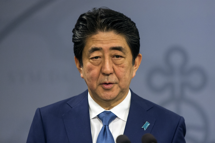 Japanese Prime Minister Shinzo Abe had tried to reset Japan-China relations in 2006 during his first term as prime minister. But what has motivated Abe to again extend an olive branch? Above, Abe gives a speech on Monday in Copenhagen, Denmark. Photo: Visual China