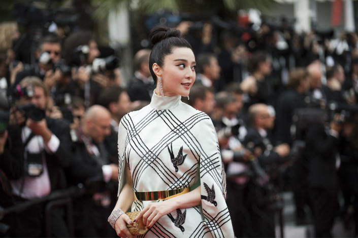 Chinese Star Fan Bingbing has vowed to take fugitive businessman Guo Wengui to U.S. court after she claims he 'viciously' defamed her. Above,  Fan attends the Cannes Film Festival in France on May 26. Photo: IC