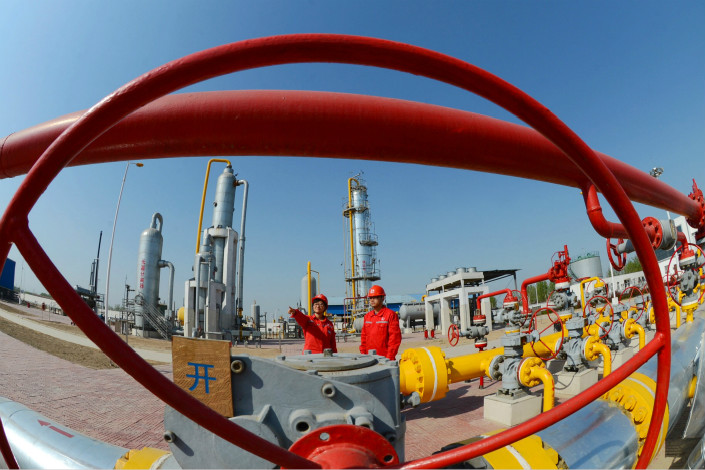 In 2015, natural gas accounted for about 5.9% of China’s energy consumption. The government wants that figure to reach 10% by 2020 and 15% by 2030. Above, workers conduct a safety inspection on a natural gas transmission facility in April 2014 in Henan province. Photo: Virtual China