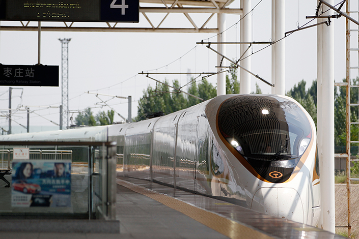 China's move to have the Beijing-to-Shanghai high-speed train run at 350 kph will make it the world's fastest. Above, a high-speed Fuxing train enters the Zaozhuang station in Shandong province on June 26. Photo: Visual China