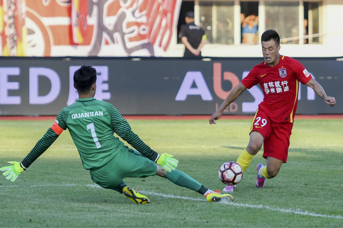 Beijing-based game-maker Crazy Sports will be allowed to develop and market Chinese Super League (CSL) games worldwide under a new partnership with the professional soccer league. Above, Changchun Yatai and Tianjin Quanjian play to a draw in 2017 CSL action. Photo: Visual China