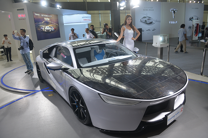 Hanergy’s Silicon Valley-based subsidiary, Alta Devices, will design a roof system embedded with a thin solar film for a new Audi vehicle, the companies announced Wednesday. Above, a Hanergy Solar-R solar-powered car is displayed at the 14th China (Guangzhou) International Automobile Exhibition in Guangzhou, Guangdong province, on Nov. 18. Photo: IC