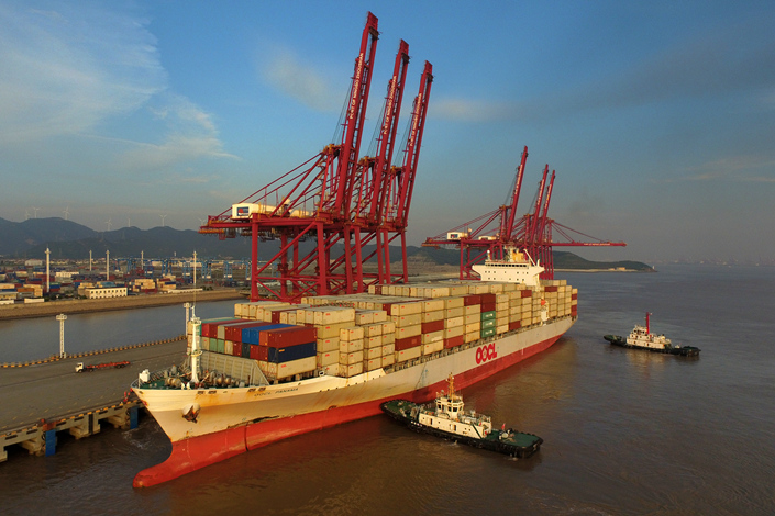 China imports soared 13.3% in August from a year ago to $157.2 billion, picking up from a gain of 11% in July. Above, a ship docks at a port in Zhoushan, Zhejiang province, on July 14 to unload containers. Photo: Visual China