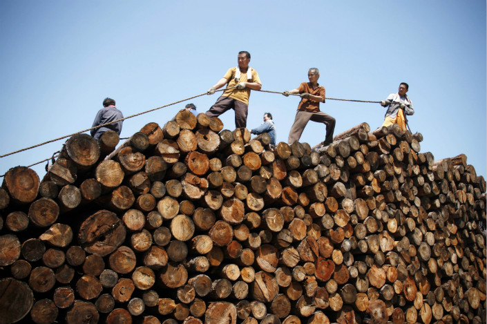 Workers in Anhui province stack lumber, one of the products used by the National Bureau of Statistics to calculate the official producer price index. Photo: IC