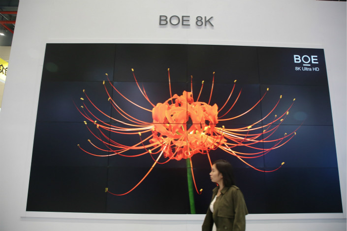 BOE Technology Group Co. Ltd.’s third-quarter revenue rose 28% to 25 billion yuan ($3.78 billion), while its profit more than tripled to 2.2 billion yuan. Above, BOE unveils the country's largest ultrahigh-definition TV screen at the China Guanggu International Photoelectronics Expo on Wednesday. Photo: IC