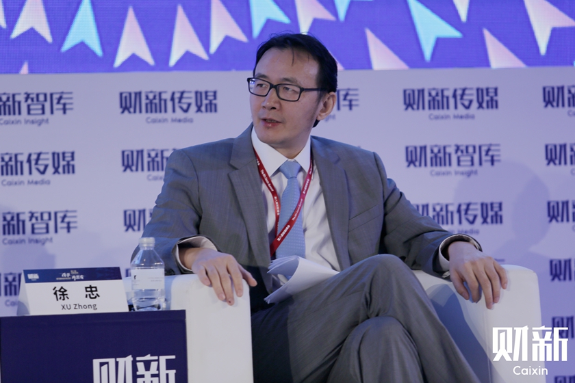 Xu Zhong, director general of the research bureau of the People’s Bank of China, said at the 8th Caixin Summit in Beijing on Thursday that Chinese policymakers' excessive focus on stability will cause hesitation in pushing ahead with reforms and delays — a situation that could eventually lead to a “big crisis.” Photo: Du Guanglei/Caixin