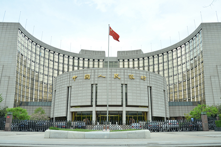 The central bank has been tightening controls over some financial holding companies that have been able to profit from a regulatory vacuum and sell innovative new products that could pose risks to the stability of the financial system. Photo: Ma Minhui/Caixin