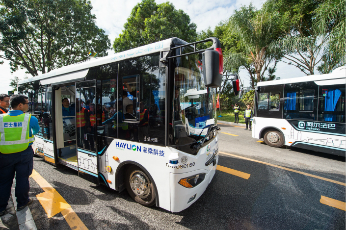 Despite recent success in driverless-car technology in China, the industry still faces stiff regulatory hurdles. Above, self-driving buses operate during tests in Shenzhen, Guangdong province, on Saturday. Photo: IC