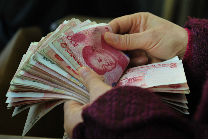China may have to raise its personal income tax to create room for a reduction in its corporate tax as it seeks to stay attractive to investors. Legislation going through the U.S. Congress could lead capital to flow back to the United States. Photo: Visual China