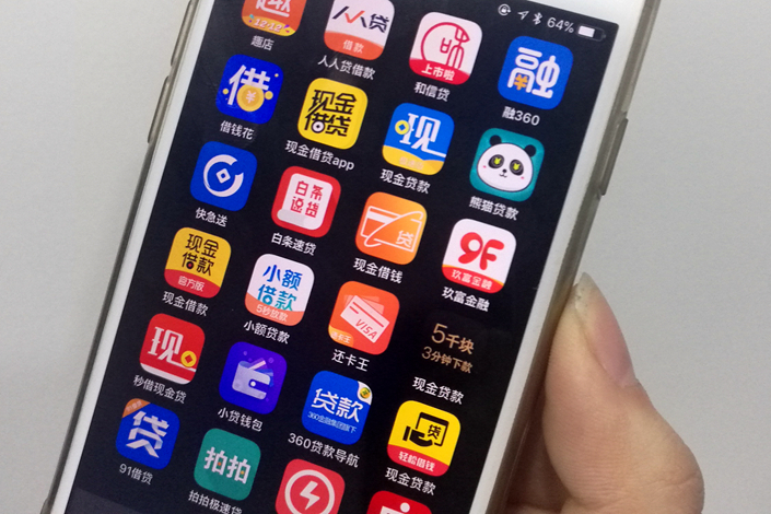 Online lending services are easy to find on smartphone app stores, but their ranks might be thinned as some listed companies had already shelved their plans to expand into the business now that the government has come up with more stringent regulations for the industry. Photo: Caixin