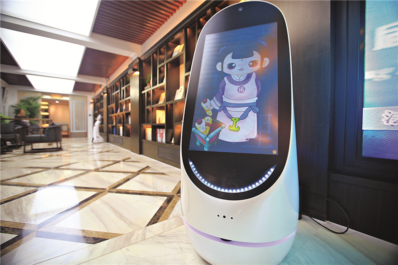 “Xiao Fake,” a legal-services robot shown here on demonstration in a Beijing law bookstore, can help users by doing such things as identifying laws and guidelines, and searching for historical case records. Photo: Caixin