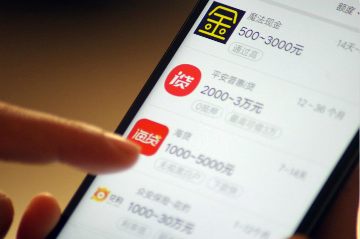 China's banking regulator has issued more detailed regulations for online lending of small, cash loans. The regulations outlined 11 key areas of evaluation for all online microlenders, including borrowing costs, information security, loan management and collection methods. Photo: Visual China