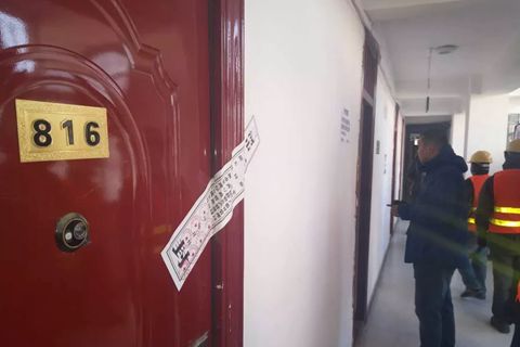 Officials sent to carry out evictions in a village under the administration of Yanjiao town, which neighbors Beijing, told locals that their actions had been modeled on practices adopted by authorities in the Chinese capital following a deadly fire that killed 19. The above picture shows eviction notices posted on apartments in the village. Photo: Sanhe government