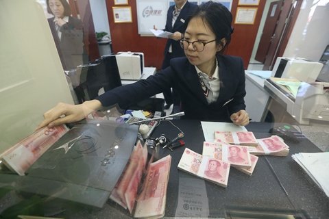 The new rules will introduce industrywide requirements on leverage ratios, risk reserve funds and investment restrictions to all types of asset management products offered by financial institutions. Photo: VCG