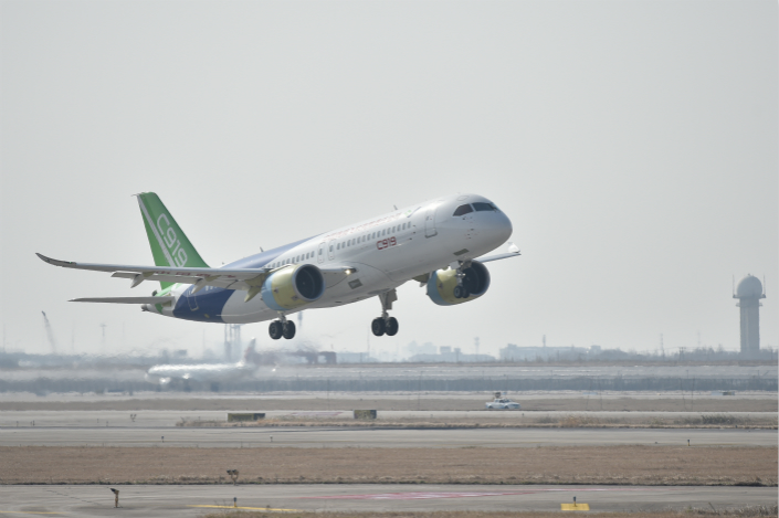 A domestically produced C919 takes off from Shanghai Pudong International Airport during the model's second test flight in December. The airplane's state-owned manufacturer aims to have all its C919s tested within the next five years. Photo: VCG