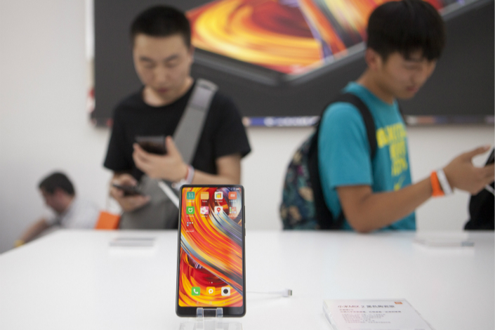 A Xiaomi Mi Mix 2 smartphone sits on display at a launch event in Beijing in September. The Chinese smartphone-maker opened a store on Monday in Quezon City near Manila in the Philippines. Photo: VCG