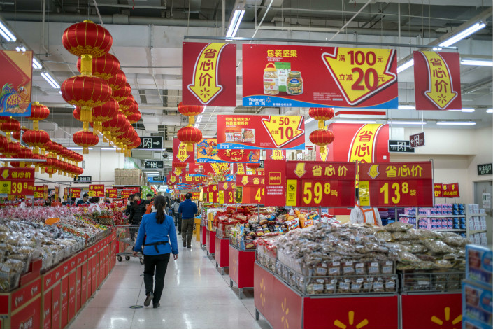 Shoppers peruse a Beijing Walmart on Jan. 15, 2017. Photo: VCG