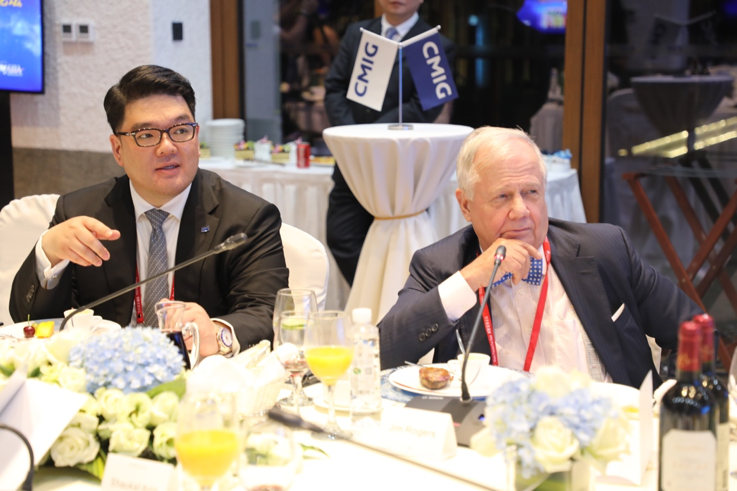 CMIG Executive Vice Chairman Kevin E. Lee (left) and Rogers at the dinner forum