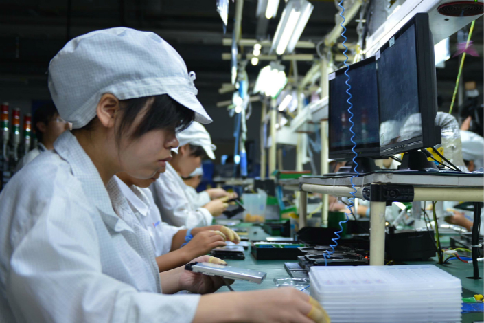 A production line of Foxconn Technology Group is seen in Yantai, Shandong province, in August 2012. Photo: VCG