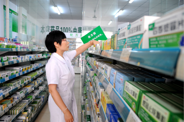 An employee of a drugstore in Lianyungang, Jiangsu province, sorts medicines on July 1. Photo: VCG