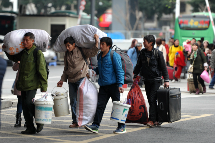 Migrant workers enter Fuzhou Railway Station on April 27. Photo: VCG
