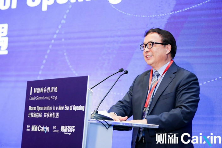 Chen Wenhui, vice chairman of the China Banking and Insurance Regulatory Commission, delivers a keynote speech on June 8 at the Caixin Summit in Hong Kong. Photo: Ye Wanqing/Caixin