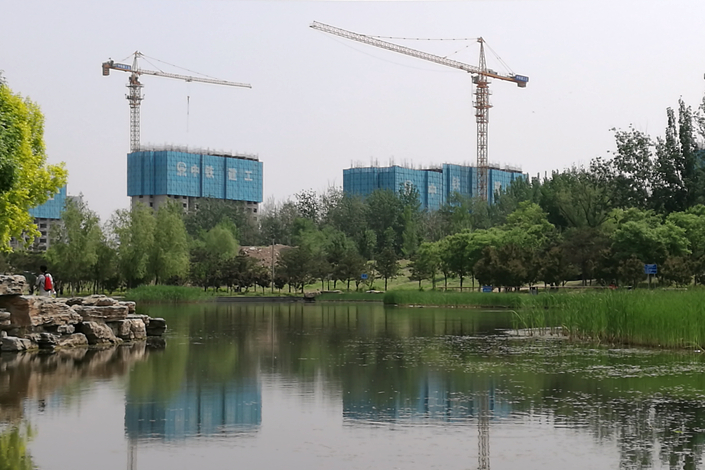Several buildings under construction in eastern Beijing in April. Photo: Wu Gang/Caixin