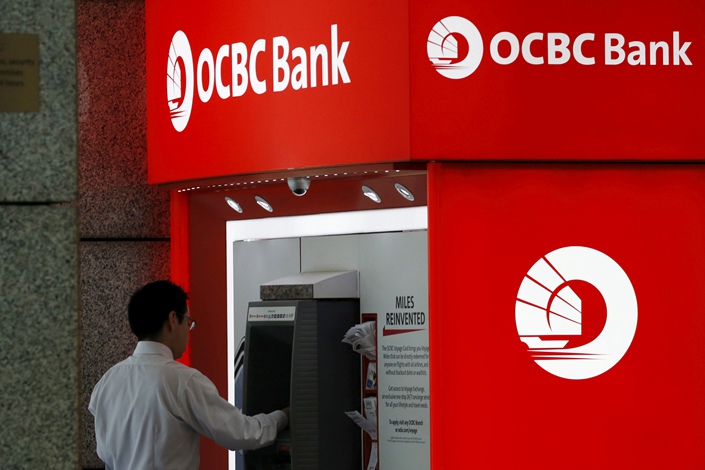 An ATM operated by Oversea-Chinese Banking Corp. Ltd. is seen in Singapore’s central business district in January 2016. Photo: VCG